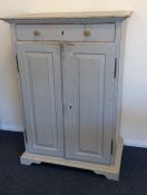 A good painted pine two door cupboard with sloping