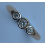 A good 9 carat three stone diamond ring. Est. £40