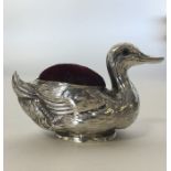 A novelty silver pin cushion in the form of a duck