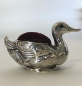 A novelty silver pin cushion in the form of a duck