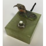 A small cold painted bronze of a hen pheasant on o