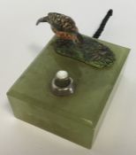 A small cold painted bronze of a hen pheasant on o