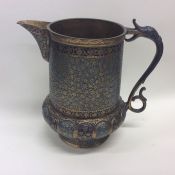 An Antique brass and enamel Continental jug attrac