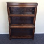 An oak three stack bookcase with glazed doors in t