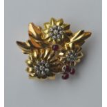 GHISO: A stylish ruby and diamond brooch in the fo