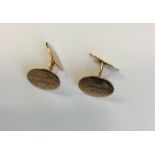 A pair of Continental 18 carat cufflinks engraved