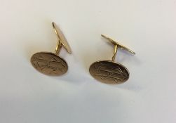 A pair of Continental 18 carat cufflinks engraved