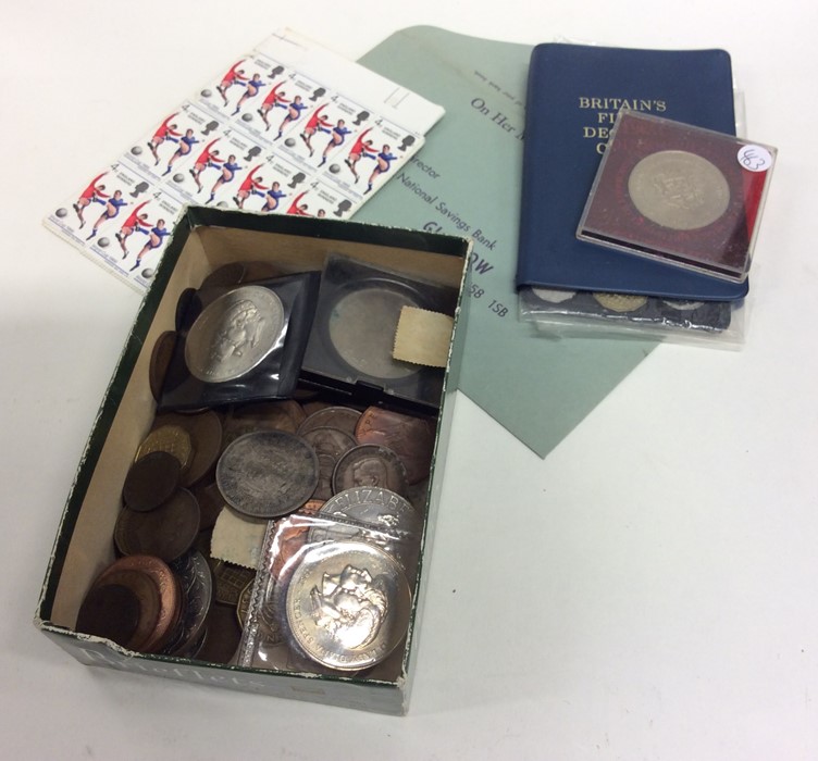 A box containing decimal coinage, copper coinage a