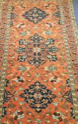 A good large rug decorated in bright colours with