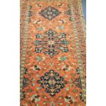 A good large rug decorated in bright colours with