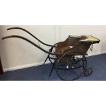 A unusual Victorian child's pram with spoked wheel