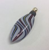 A miniature swirl glass scent bottle decorated in