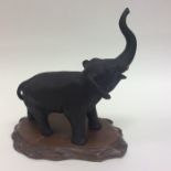 A good quality bronzed model of an elephant with t