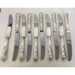 A set of ten kings' pattern knives with silver han