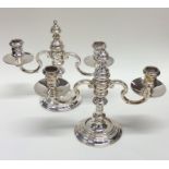 A good pair of two branch silver candelabra of Geo