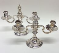 A good pair of two branch silver candelabra of Geo