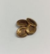 A pair of plain oval 9 carat cufflinks. Approx. 4