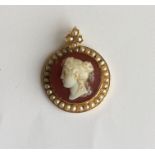 An attractive circular hard stone cameo of a lady'