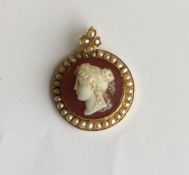 An attractive circular hard stone cameo of a lady'