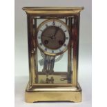 A good quality brass mantle clock with white ename