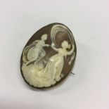 An oval cameo of a lady together with a child in g