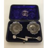A boxed pair of silver salts together with matchin