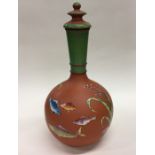 A stylish earthenware vase and cover decorated wit