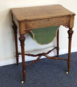 A Victorian burr walnut sewing box on tapering sup