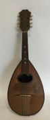 An old maple mandolin. Est. £20 - £30.