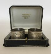 A pair of attractive silver napkin rings decorated