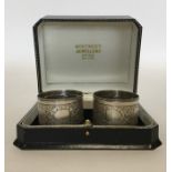 A pair of attractive silver napkin rings decorated