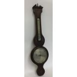 A mahogany and shell inlaid banjo barometer with s