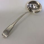 A heavy Georgian silver fiddle pattern soup ladle.