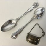 A pair of silver teaspoons attractively decorated
