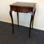 A French single drawer side table on cabriole supp