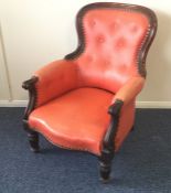A Victorian button back chair on turned and reeded