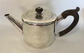 A Georgian silver bachelor's teapot engraved with