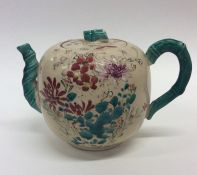 An Oriental pottery oviform teapot and cover paint