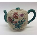 An Oriental pottery oviform teapot and cover paint