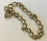 A 9 carat bracelet with heart shaped padlock. Appr