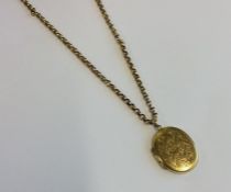 A 9 carat locket on fine link chain. Approx. 10 gr