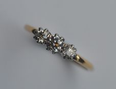 A good Antique diamond three stone ring in claw mo