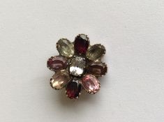 An Antique garnet and crystal brooch in the form o