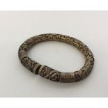CHINESE: A good quality silver cast torque bangle