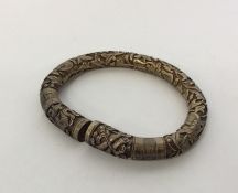 CHINESE: A good quality silver cast torque bangle