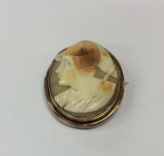 An oval shell cameo of a warrior in gold frame. Ap