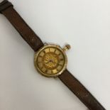 A lady's 18 carat slim wristwatch with gilt dial a