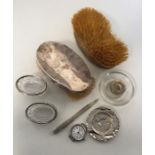 A silver mounted lucifer, hairbrush, watch etc. Es