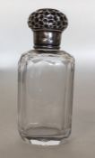 A small silver mounted scent bottle with embossed