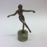 A small model of a dancing lady on onyx base, and